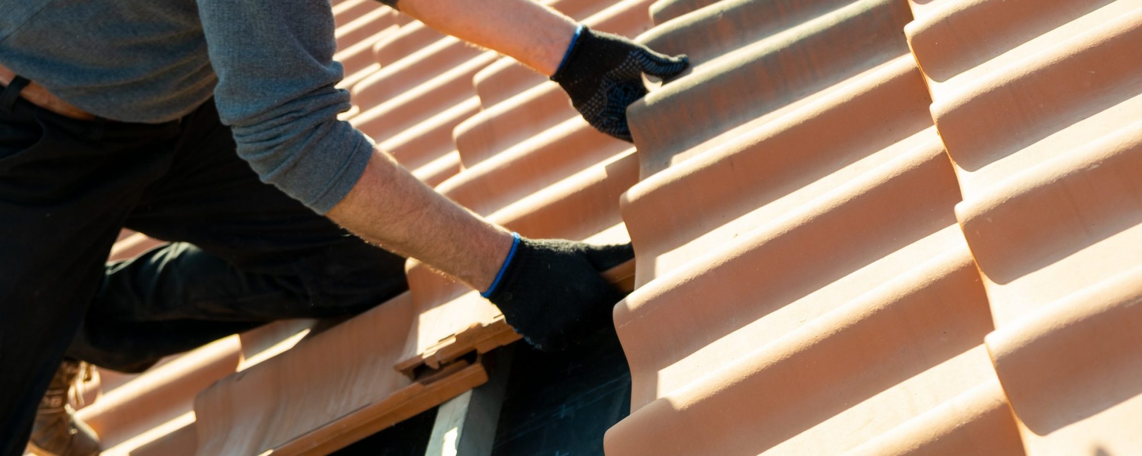 Closeup,Of,Worker,Hands,Installing,Yellow,Ceramic,Roofing,Tiles,Mounted